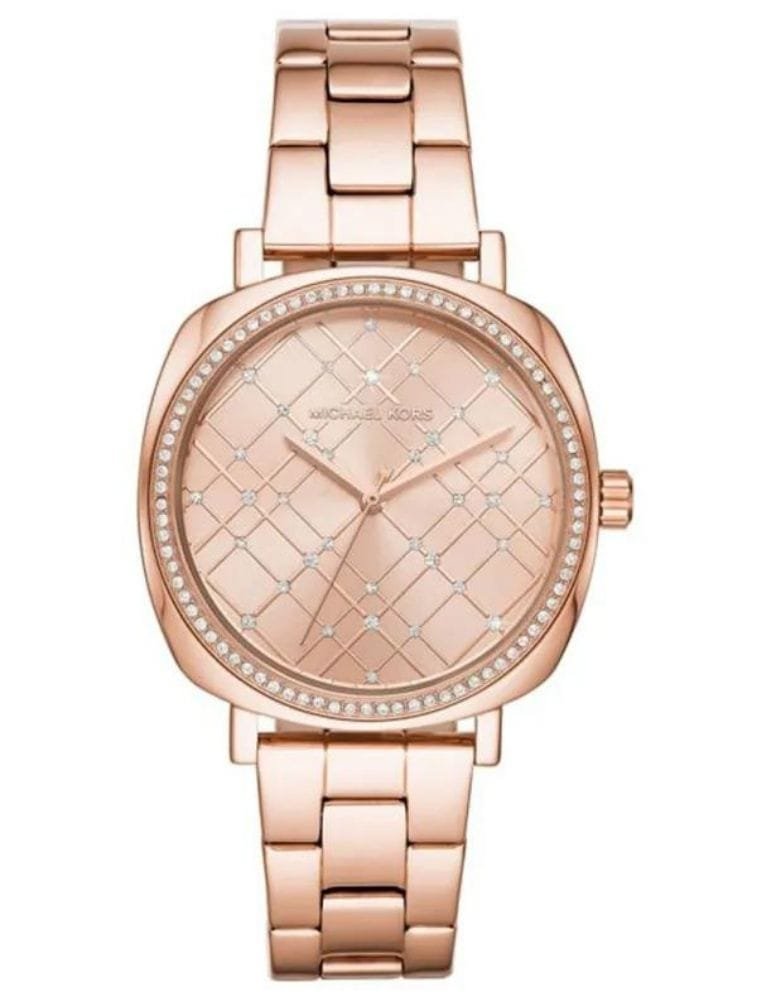 Marque: Michael Kors Modèle: NIA Boîtier: Diamètre : 38 mm Epaisseur : 8 mm Acier inoxydable Bronze Cadran: Verre : Minéral Bronze Bracelet: Acier inoxydable Bronze Etanchéité: 50 m (5 ATM) Type de boucle: Boucle déployant