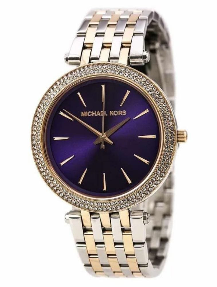Marque: Michael Kors Modèle: Darci Boîtier: Diamètre : 39 mm Epaisseur : 14 mm Acier inoxydable Argent, doré Cadran: Verre : Minéral Violet Bracelet: Acier inoxydable Argent, doré Etanchéité: 50 m (5 ATM) Type de boucle: Boucle déployante