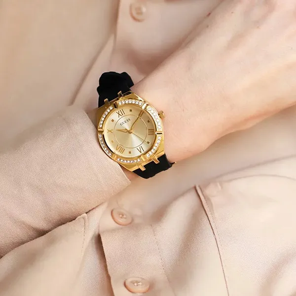 a person wearing a gold watch
