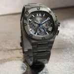 Montre Guess GW0572G5 Headline homme vue de profil, poussoirs, couronne et bracelet en acier gunmetal brossé