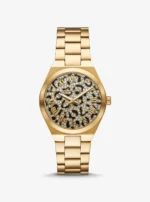 Montre Michael Kors MK7500 Lennox de face, cadran animalier noir et doré pavé de cristaux et bracelet acier doré
